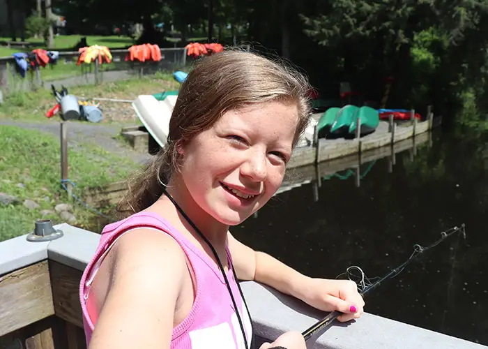 A kid fishing in a lake